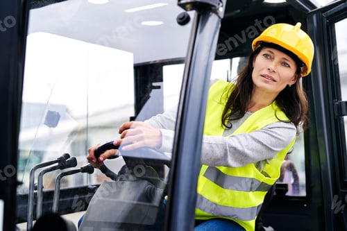 Preview: Adult caucasian woman driving a forklift