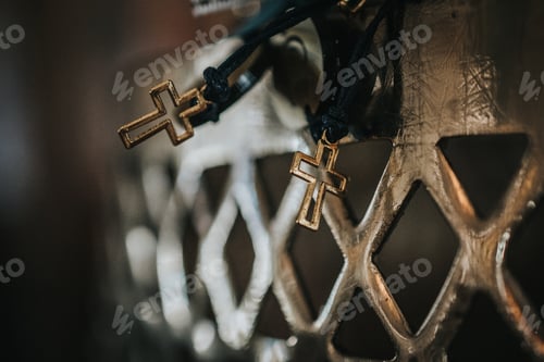 Preview: Hanging golden crosses with black strings
