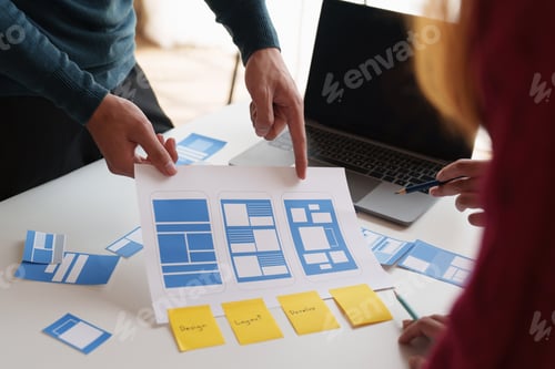 Preview: Group of ux developer and ui designer brainstorming about app interface design at modern office