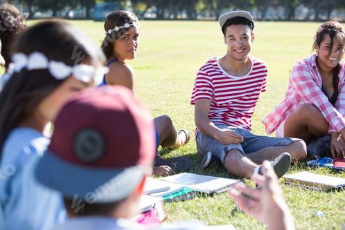 Preview: Group of friends enjoying a sunny day in the park.