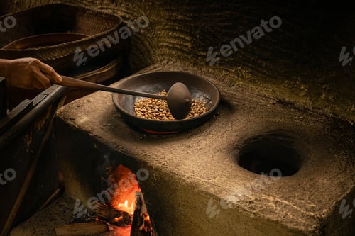 Preview: Cooking on an open fire with a wooden spoon in Bali