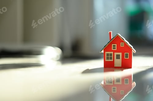 Preview: House model on floor, real estate and housing aspirations concept.