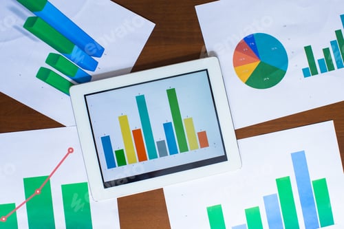 Preview: Colorful Business Data and Charts on a Table