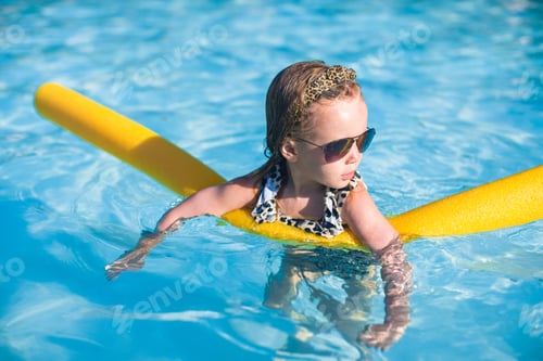 Preview: Little adorable girl have fun in the swimming pool