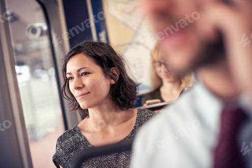 Preview: A woman on a busy bus looking out of the window