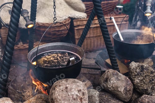 Preview: Bowl with a mulled wine on the open fire