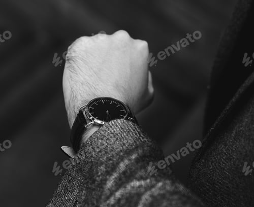 Preview: Man looking at his watch