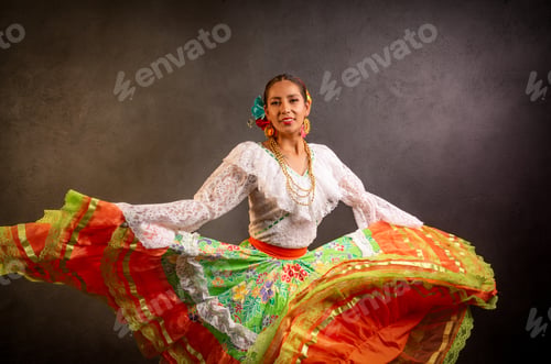 Preview: A woman in a colorful skirt and blouse is dancing