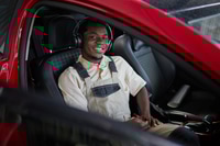 Preview: Portrait of Young Adult Black Man Smiling While Sitting Inside Car