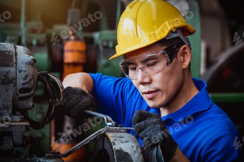 Preview: Engineer worker wearing safety uniform control operating computer controlled Lathe grinding machine