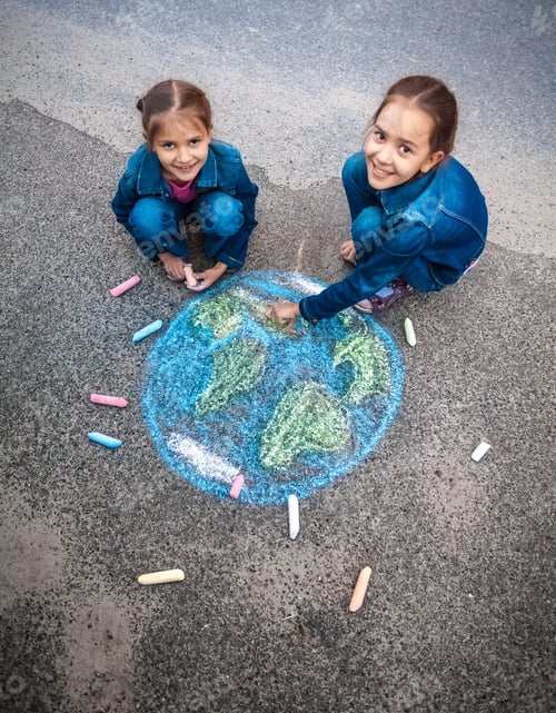 Preview: smiling girls drawing Earth with chalks on street