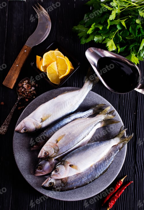 Preview: small fish on plate with spice and herb