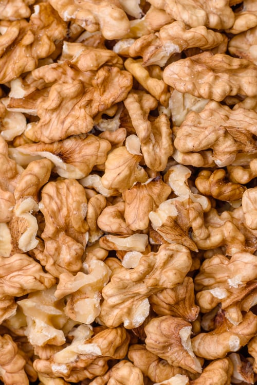 Preview: Delicious fresh peeled raw walnuts in a ceramic plate