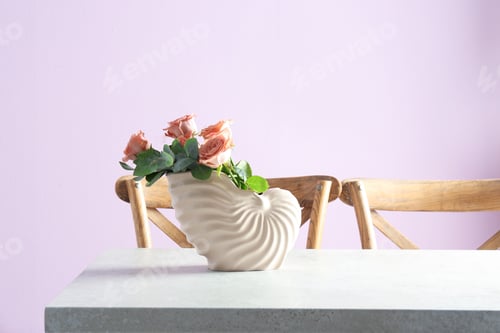 Preview: Vase with beautiful flowers as element of interior design on table in room