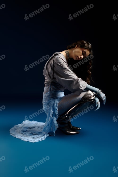 Preview: Stylish young woman showcases unique fashion in a creative studio setting