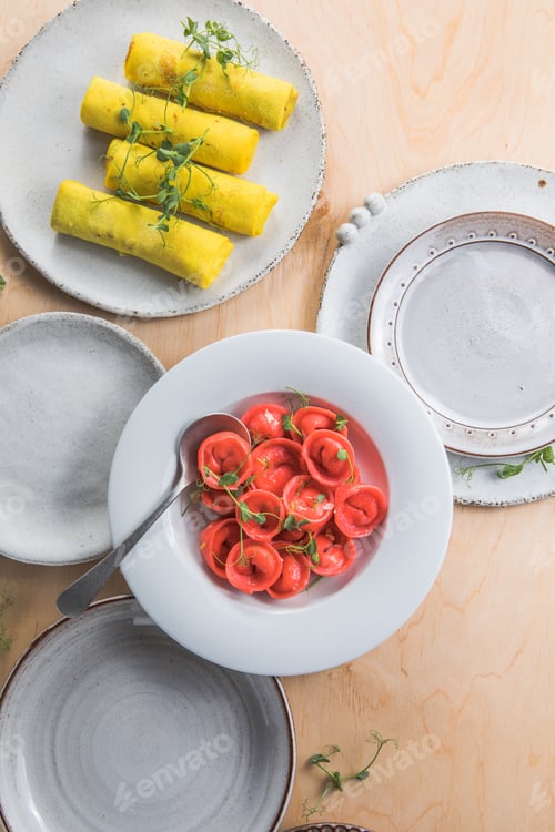 Preview: Homemade tortelli - italian pink pasta, and crepe filled with ricotta .