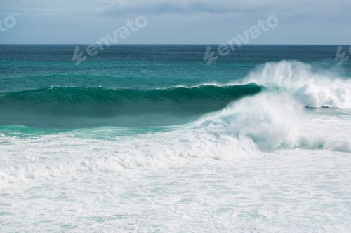 Preview: view from the beach to a tropical island and some granite rocks in the sea