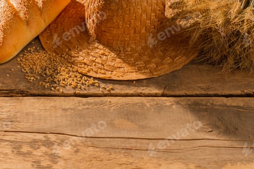 Preview: Artisan Bread and Wheat on Wooden Table