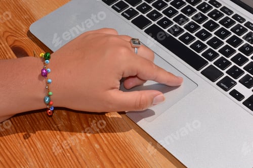 Preview: Hand on laptop touchpad