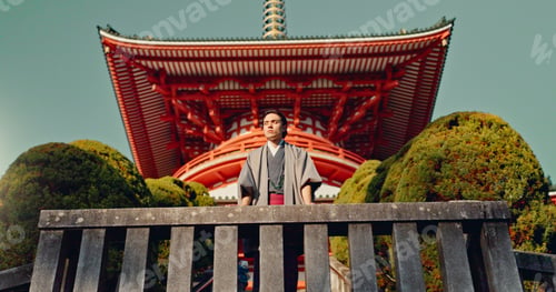 Preview: Man, Japanese shinto temple and traditional clothes for culture, building or religion in sunshine.