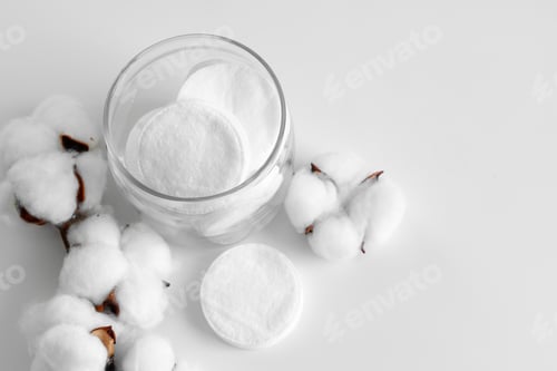Preview: Cotton discs for skincare in a jar on paper background