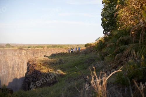 Preview: Tourists on cliff top, Victoria Falls, Zimbabwe