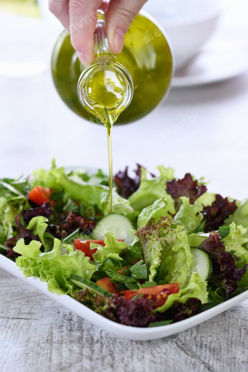Preview: Salad preparation with pouring dressing, healthy lunch