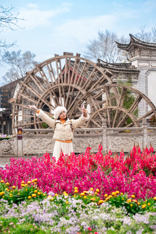Preview: Young female tourist enjoys traveling at Lijiang Ancient Town