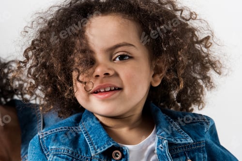 Preview: Clase-up portrait of cute african american baby girl in denim jacket