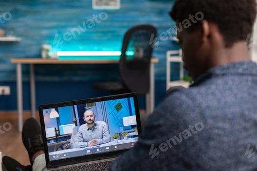 Preview: Student having online business course on laptop