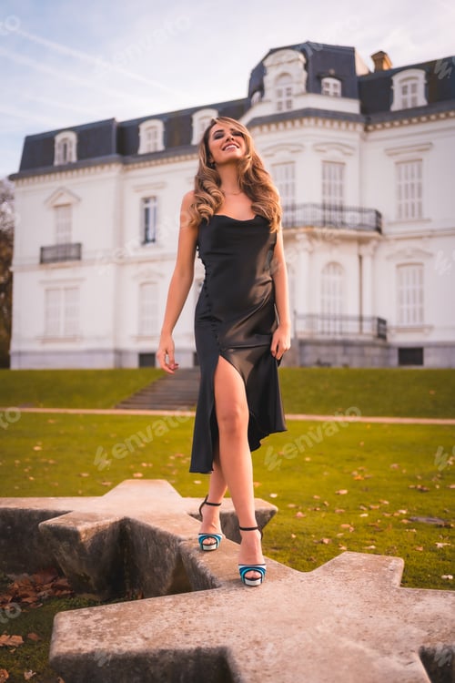 Preview: Caucasian girl in a black dress in a white building