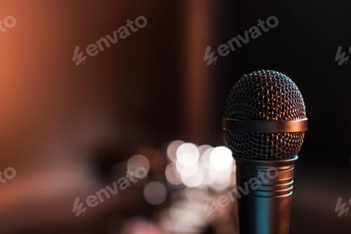 Preview: Close-up view of black electric microphone on empty stage