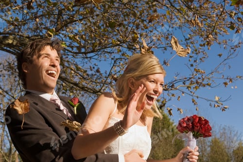 Preview: A wedding couple in an autumn wind