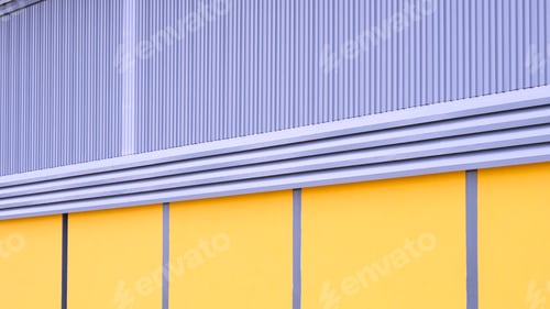 Preview: Steel louver ventilation on aluminum corrugated iron and yellow concrete wall of Warehouse building