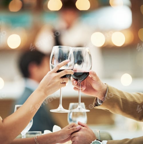 Romantic Couple Toasting with Wine at Dinner
