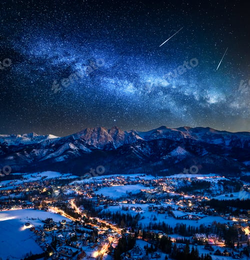 Preview: Illuminated Zakopane city in winter and milky way at night