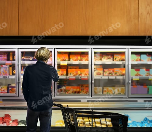 Preview: Man Choosing Frozen Food From A Supermarket Freezer