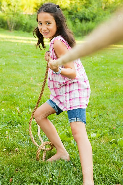 Preview: Girl pulling rope in game of tug of war