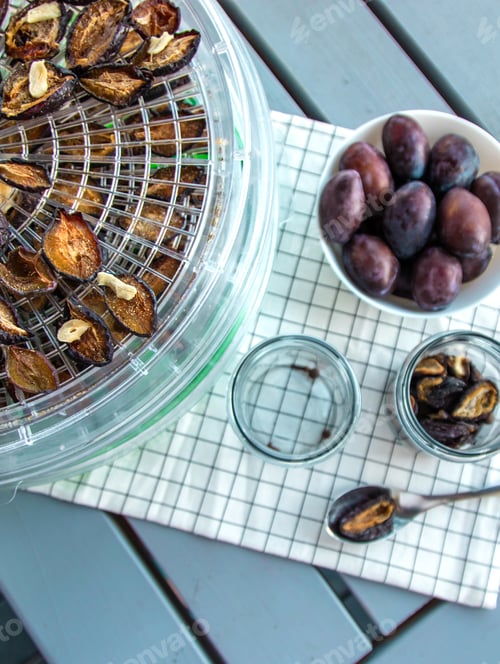 Preview: Plums dried in a dehydrator. Selective focus.