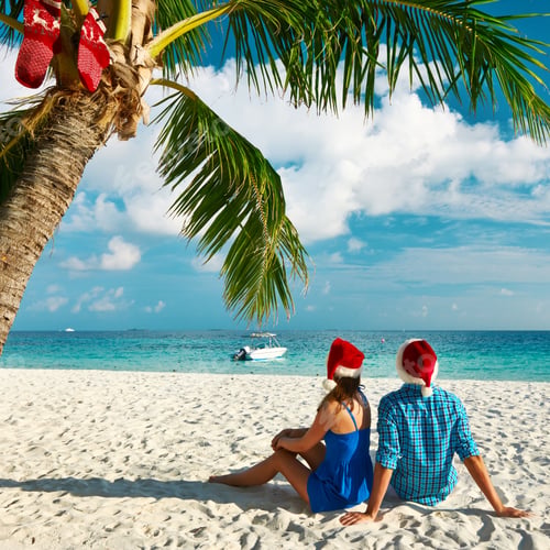 Preview: Couple In Blue Clothes On A Tropical Beach At Christmas