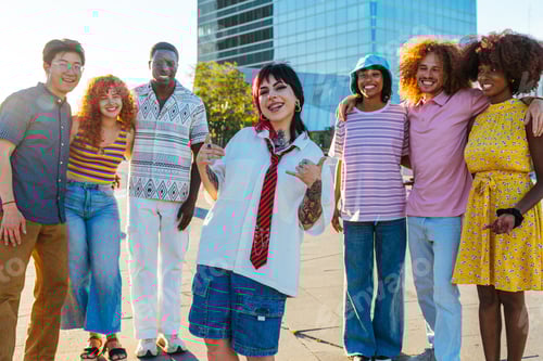 Preview: Multiethnic group of young friends meeting and having fun outdoors