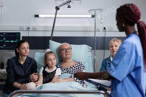Preview: African american female nurse filling out recovery report of sick man