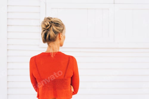 Preview: Woman with Updo and Orange Top in White Room
