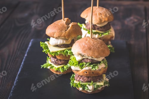 Preview: Stacked Mini Burgers with Lettuce on a Plate