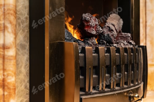Preview: Wood logs burning in fireplace close up