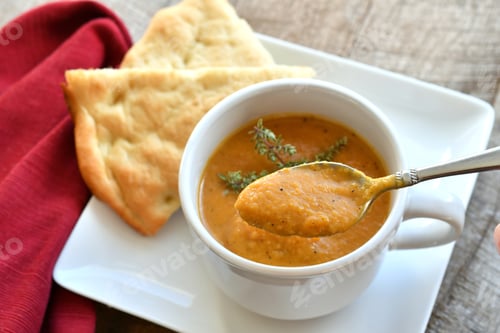 Preview: Close up of Soup and Bread on Plate