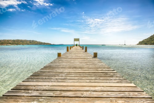 Preview: Astonishing landscape with wooden pier on Santa Giulia beach.