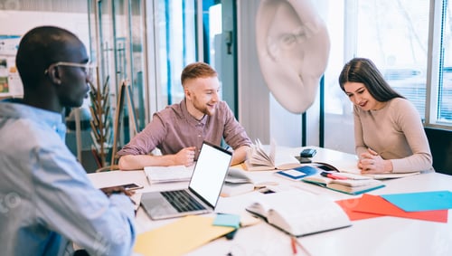 Preview: Students laughing while reading book