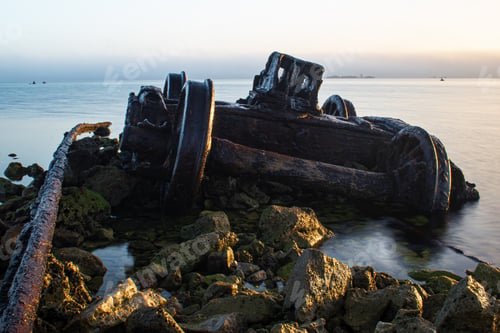 Preview: Closeup of old metal wheels on an an abandoned jetty