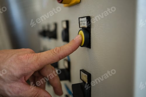 Preview: Hand pressing a control button